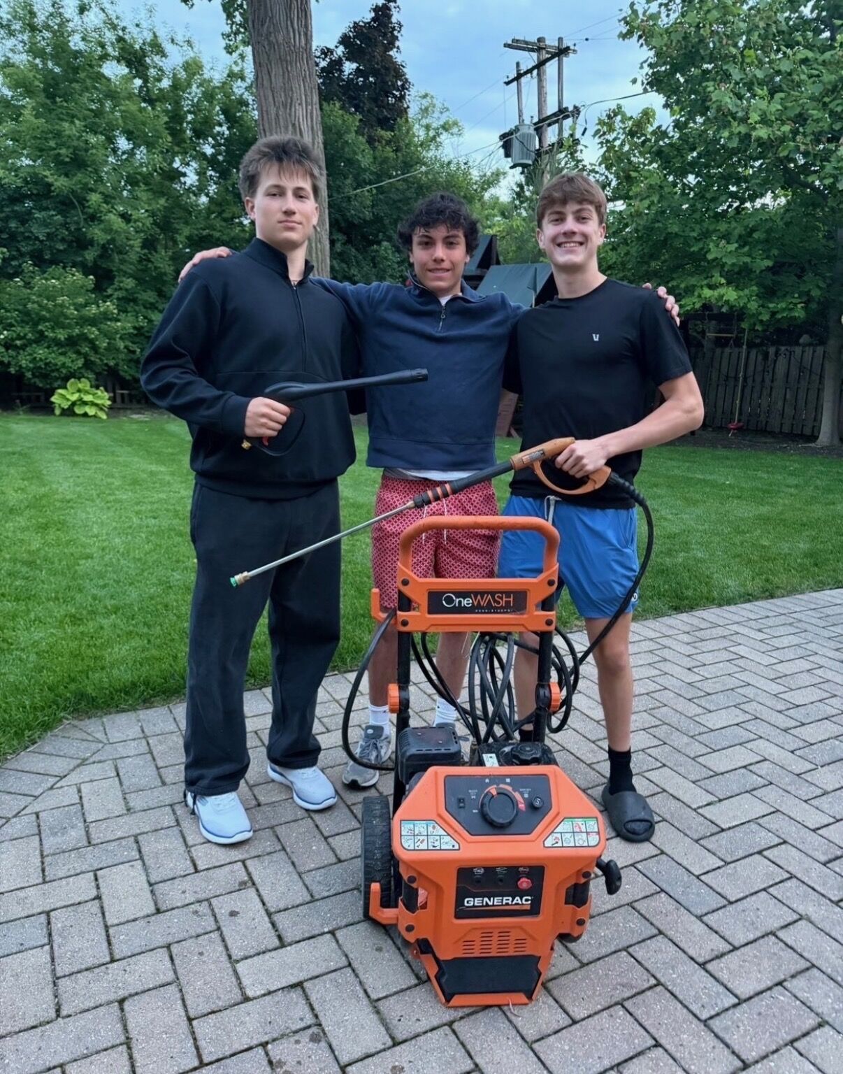 The Peak Property Services crew with their pressure washing equipment